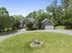 Charming brick home with a circular driveway and well-manicured lawn and landscaping at 265 Verde Rd, Apex, NC 27523