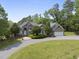 Beautiful brick home featuring an attached garage, well maintained yard, and long driveway at 265 Verde Rd, Apex, NC 27523