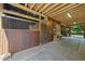 Angle view of the barn featuring wooden stalls and tack equipment inside at 265 Verde Rd, Apex, NC 27523