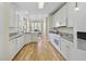 White kitchen with granite countertops and stainless steel appliances at 265 Verde Rd, Apex, NC 27523