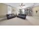 Spacious recreation room, featuring leather couches and built-in shelving at 265 Verde Rd, Apex, NC 27523