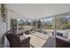 Enclosed sunroom with floor-to-ceiling windows, letting in lots of natural light at 265 Verde Rd, Apex, NC 27523