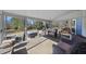 Enclosed sunroom with views of the fenced yard and hot tub, perfect for relaxing at 265 Verde Rd, Apex, NC 27523