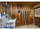 Tack room featuring hardwood walls, storage and tack equipment at 265 Verde Rd, Apex, NC 27523