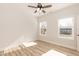 Light filled bedroom with two windows, ceiling fan and attractive wood-look floors for a modern feel at 343 Foster St, Burlington, NC 27217