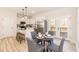 Eat-in kitchen with island seating, stainless appliances, and an adjacent dining area with doors to outdoor deck at 343 Foster St, Burlington, NC 27217