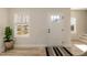 Bright entryway with wood floors, a decorative rug, and natural light from the window at 343 Foster St, Burlington, NC 27217