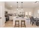 Modern kitchen with white cabinetry, stainless steel appliances, and center island with barstool seating at 343 Foster St, Burlington, NC 27217