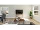 Cozy living room with a television, stylish decor, and a comfortable seating area at 343 Foster St, Burlington, NC 27217