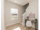 Upstairs landing space with built-in desk, chair, and window providing natural light for study or work at 343 Foster St, Burlington, NC 27217