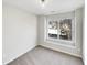 Bright bedroom with large window and carpet at 3743 Bison Hill Ln, Raleigh, NC 27604
