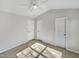 Sunlit bedroom with ceiling fan and doors at 3743 Bison Hill Ln, Raleigh, NC 27604