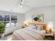 Virtually staged bedroom with large window and ceiling fan at 3743 Bison Hill Ln, Raleigh, NC 27604
