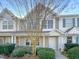 Two-story townhome with neutral siding and landscaping at 3743 Bison Hill Ln, Raleigh, NC 27604