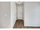 Hallway with light walls and wood-look flooring at 3743 Bison Hill Ln, Raleigh, NC 27604