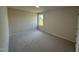 Well-lit bedroom featuring carpet and a window at 39 Shiloh Dr, Lillington, NC 27546