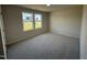 Bright bedroom with carpeted floor and two windows at 39 Shiloh Dr, Lillington, NC 27546