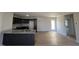 Eat-in kitchen boasts granite countertops and dark brown cabinets at 39 Shiloh Dr, Lillington, NC 27546