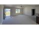 Spacious living room with high ceilings, carpet, and access to the kitchen at 39 Shiloh Dr, Lillington, NC 27546