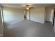 Main bedroom with ceiling fan, carpet, and en-suite bathroom access at 39 Shiloh Dr, Lillington, NC 27546