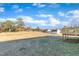 Large backyard with shed and distant view at 3901 La Varra Dr, Clayton, NC 27520