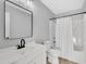 Clean bathroom with white vanity, tub shower, and updated fixtures at 3901 La Varra Dr, Clayton, NC 27520