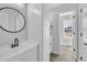 Modern bathroom with white vanity, updated fixtures, and a window at 3901 La Varra Dr, Clayton, NC 27520