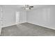 Bedroom with gray carpet and access to bathroom at 3901 La Varra Dr, Clayton, NC 27520