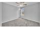 Bright bedroom with ceiling fan and neutral carpeting at 3901 La Varra Dr, Clayton, NC 27520