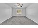 Spacious bedroom with gray carpet and ceiling fan at 3901 La Varra Dr, Clayton, NC 27520