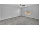 Bright bedroom with gray carpet and ceiling fan at 3901 La Varra Dr, Clayton, NC 27520