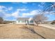 White house exterior with green shutters and a large yard at 3901 La Varra Dr, Clayton, NC 27520
