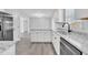 Kitchen boasts granite counters and white shaker cabinets at 3901 La Varra Dr, Clayton, NC 27520
