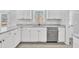 White shaker cabinets, granite countertops, and stainless steel appliances at 3901 La Varra Dr, Clayton, NC 27520