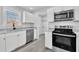 Modern kitchen with stainless steel appliances and granite countertops at 3901 La Varra Dr, Clayton, NC 27520