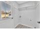 Laundry room with white shelving and exterior access at 3901 La Varra Dr, Clayton, NC 27520