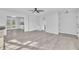 Open living area featuring hardwood floors and access to other rooms at 3901 La Varra Dr, Clayton, NC 27520