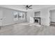 Living room with fireplace, hardwood floors, and ceiling fan at 3901 La Varra Dr, Clayton, NC 27520