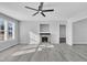 Living room with fireplace, hardwood floors, and ceiling fan at 3901 La Varra Dr, Clayton, NC 27520