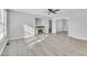Living room with fireplace, hardwood floors, and ceiling fan at 3901 La Varra Dr, Clayton, NC 27520