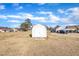 White storage shed with double doors at 3901 La Varra Dr, Clayton, NC 27520