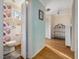 Modern bathroom connected to hall featuring floral wallpaper and sleek fixtures at 497 Turn Key Way, Pittsboro, NC 27312
