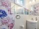 Charming bathroom featuring floral wallpaper, mirrored shower doors, and a pedestal sink at 497 Turn Key Way, Pittsboro, NC 27312