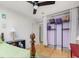 Bedroom featuring hardwood floors, ceiling fan, and open closet with shelving at 497 Turn Key Way, Pittsboro, NC 27312