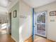Bright entryway with blue door and hardwood floor at 497 Turn Key Way, Pittsboro, NC 27312