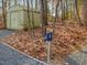 An outdoor area showcases a water spigot with a shed and a well-maintained gravel path at 497 Turn Key Way, Pittsboro, NC 27312