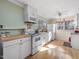 Bright kitchen with white cabinets, butcher block countertops, and modern appliances at 497 Turn Key Way, Pittsboro, NC 27312