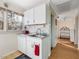 Functional kitchen with white cabinets, stainless-steel sink, and a view to the forest at 497 Turn Key Way, Pittsboro, NC 27312