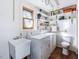 Functional laundry room featuring a washer, dryer, utility sink, and practical storage solutions at 497 Turn Key Way, Pittsboro, NC 27312