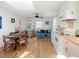 Bright living room featuring hardwood floors, a skylight, and cozy seating area at 497 Turn Key Way, Pittsboro, NC 27312